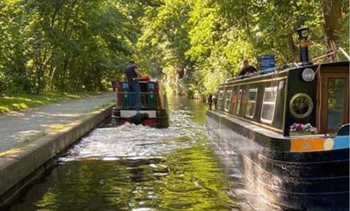 Busy Llangollen Canal Life as boats gently pass by.